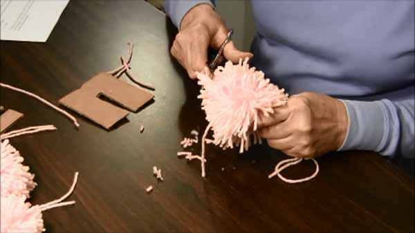 How To Make Yarn Pom Poms Needlepointers Com